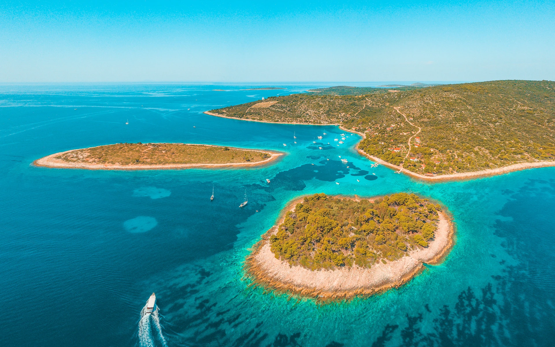 Turquoise lagoon and pine-fringed islets near Drvenik