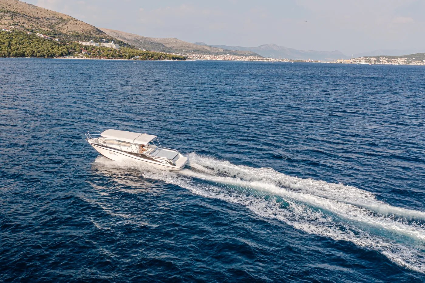 Aerial of a SeaExplore speedboat on the turquoise Adriatic