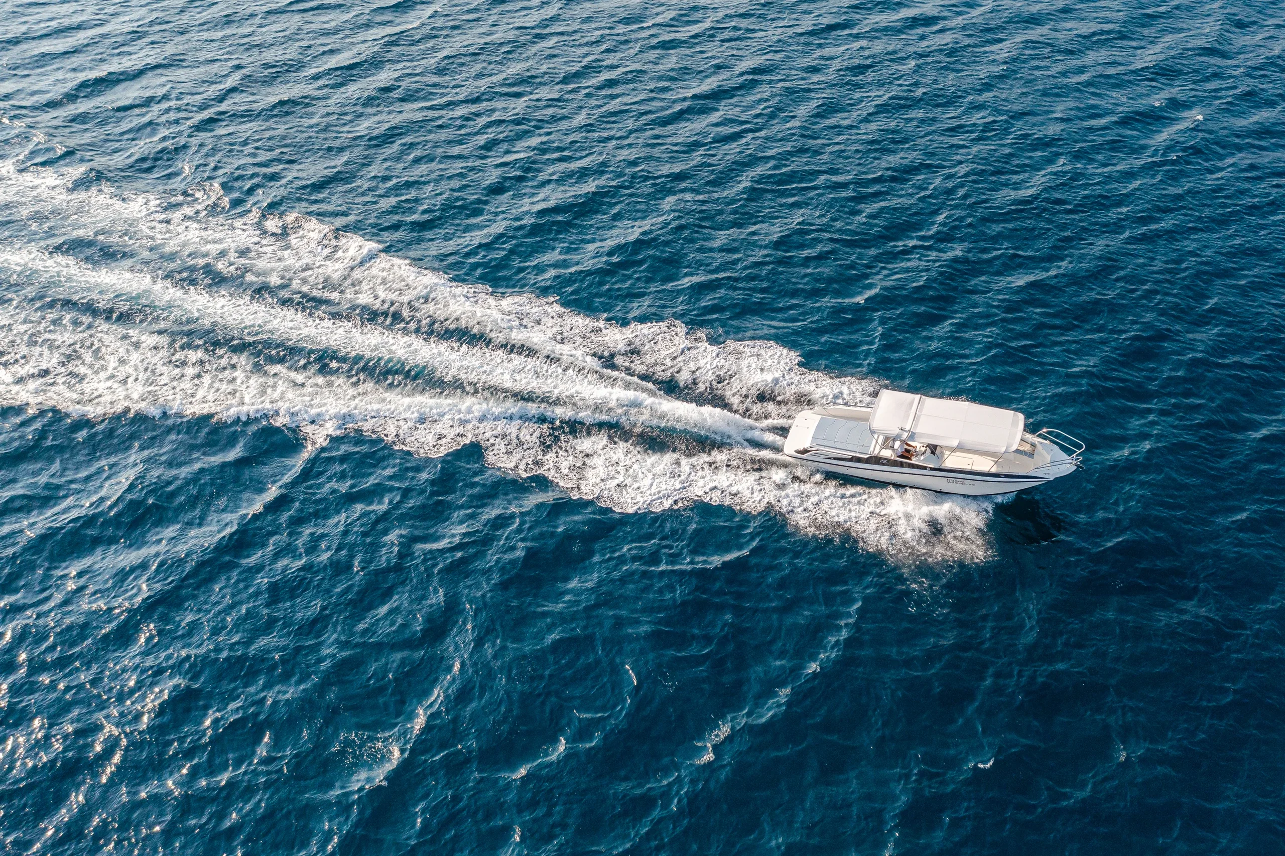 SeaExplore speedboat cutting across the deep-blue Adriatic, seen from above